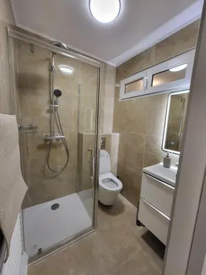 a bathroom with a shower and a toilet and a sink at Studio haut de gamme in Nice