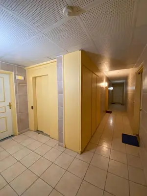 an empty hallway in a building with a ceiling at Le Spot Niçois in Nice