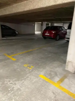 a parking garage with two cars parked in it at Le Spot Niçois in Nice