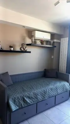a bed in a room with at Nice flat near sea and center in Nice