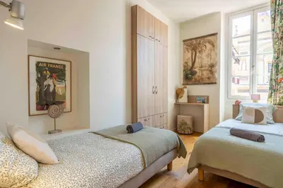 a bedroom with two beds and a window at Beautiful Provencal apartment, fully equipped, beach 300m away - FONTAINE 3 in Nice