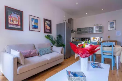 a living room with a couch and a table at Beautiful Provencal apartment, fully equipped, beach 300m away - FONTAINE 3 in Nice