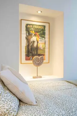 a bedroom with a poster on the wall and a bed at Beautiful Provencal apartment, fully equipped, beach 300m away - FONTAINE 3 in Nice