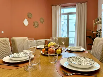 a dining room table with a bowl of fruit on it at Harmonie Nature au cœur de Nice in Nice