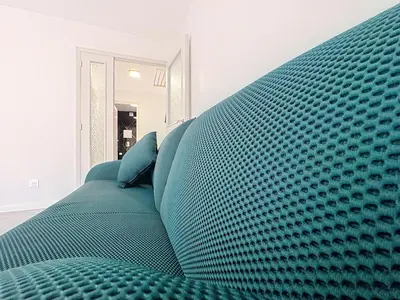 a blue couch in a living room with at Azur Stay in Nice
