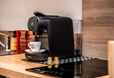 a coffee maker sitting on top of a counter at Duplex Saveria - Terrace - Netflix - Beach in Nice