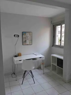 a white desk and a chair in a room at Spacious 2 BR 1 block from beaches - and the TRAM in Nice