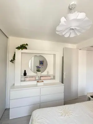 a white bedroom with a sink and a mirror at La vie est belle - T2 - Coeur de Nice in Nice