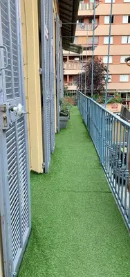 an empty hallway with green grass on a building at 3 pièces près du Port de Nice in Nice