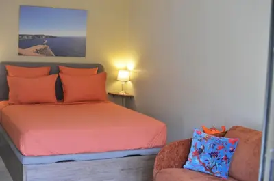 a bedroom with a bed and a chair at Rivoli Center Terrasse Clim Parking in Nice