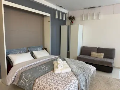 a bedroom with a bed with a towel on it at Maison Ariana in Nice