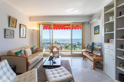 a living room with a couch and a tv at ALTAIR AP4466 by RIVIERA HOLIDAY HOMES in Nice