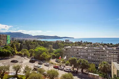 an aerial view of a building with a parking lot at ALTAIR AP4466 by RIVIERA HOLIDAY HOMES in Nice