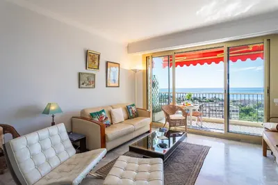 a living room with a couch and a table at ALTAIR AP4466 by RIVIERA HOLIDAY HOMES in Nice
