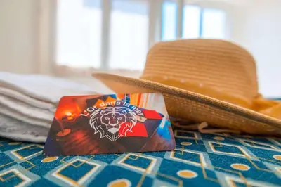 a cowboy hat and a bag of chips next to a hat at l'Or dans la Mer Partner in Nice