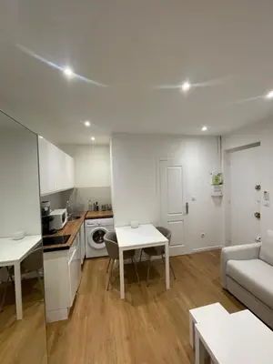 a kitchen and living room with a couch and a table at Studio cosy - Nice Mont Boron in Nice