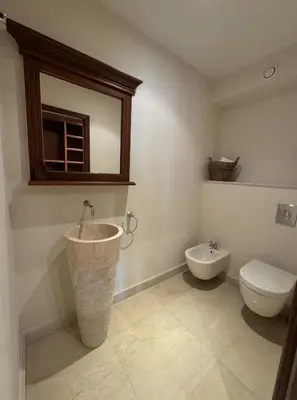 a bathroom with a sink and a toilet and a mirror at Villa Ezea - vue mer et charme in Èze