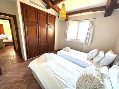 a bedroom with two beds and a window at Villa Ezea - vue mer et charme in Èze