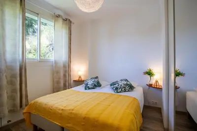 a bedroom with a bed with two pillows on it at VISTA MARE AP4459 By Riviera Holiday Home in Villefranche-sur-Mer