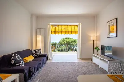 a living room with a couch and a tv at VISTA MARE AP4459 By Riviera Holiday Home in Villefranche-sur-Mer