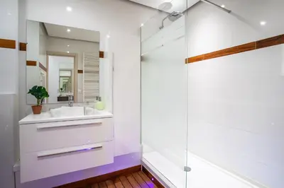 a bathroom with a sink and a mirror at VISTA MARE AP4459 By Riviera Holiday Home in Villefranche-sur-Mer