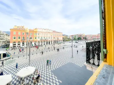 a group of people walking around a plaza in a city at Place Massena 4 Pers AC WiFi in Nice