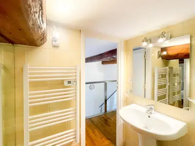 a bathroom with a sink and a mirror at Place Massena 4 Pers AC WiFi in Nice