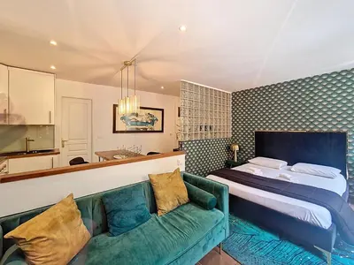 a bedroom with a bed and a couch at Nestor&Jeeves - REFLET DOR - Vieux Nice - Near beach in Nice