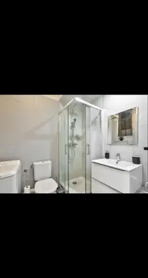 a bathroom with a shower and a toilet and a sink at Appartement 3 pièces in Nice