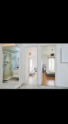 a view of a room with a bedroom and a bed at Appartement 3 pièces in Nice