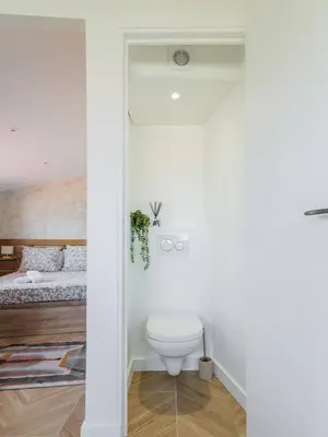 a bathroom with a toilet in a bedroom at 12, Boulevard Jean Jaures - Studio in Nice