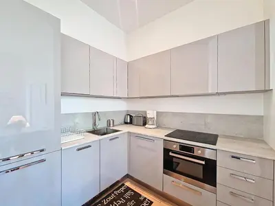 a white kitchen with white cabinets and a sink at Nestor&Jeeves - JEAN MEDECIN - Central - Modern in Nice