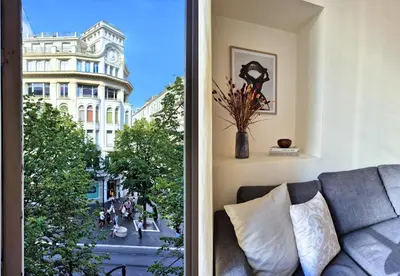 a living room with a couch and a view of a city at Nestor&Jeeves - JEAN MEDECIN - Central - Modern in Nice