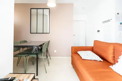 a living room with a couch and a table at Le Neoroch in Nice