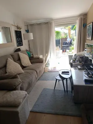 a living room with a couch and a table at Maison hauteur Nice in Nice