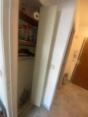 an empty room with an empty pantry in a house at Studio 112 in Nice
