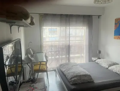 a bedroom with a bed and a window at Studio 112 in Nice