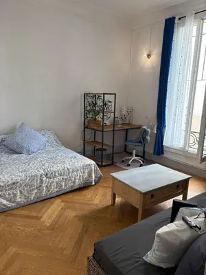 a bedroom with a bed and a desk and a table at Studio spacieux - Centre de Nice, proche mer & gare in Nice