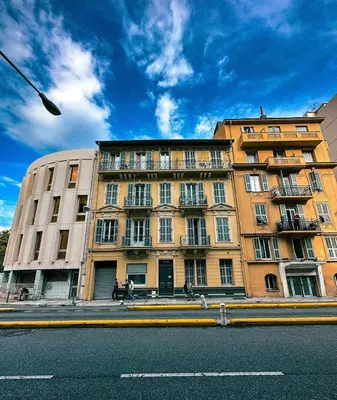 a large building on the side of a street at AngeVert HolidayHouse in Nice