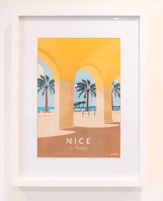 a framed picture of a beach with palm trees at L'Escale Niçoise in Nice