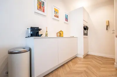 a room with white cabinets and a counter at L'Escale Niçoise in Nice