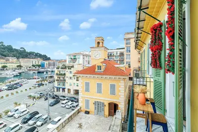 a view from a balcony of a building with a clock tower at Sunlight Properties - Archibald - Nice Port area, 2 Bedrooms, stunning holiday rental apartment with balcony & parking in Nice