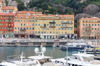 a group of boats docked in a harbor with buildings at Sunlight Properties - Archibald - Nice Port area, 2 Bedrooms, stunning holiday rental apartment with balcony & parking in Nice