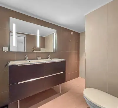 a bathroom with a sink and a mirror at Havre de paix avec terrasse in La Gaude