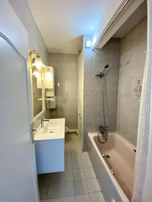 a bathroom with a sink and a tub at Nice West Pretty one bedroom in Nice