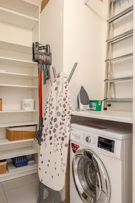 a washer and dryer in a laundry room at Bella Nissa Bnb - AC wifi - cosy - 2 bedrooms in Nice