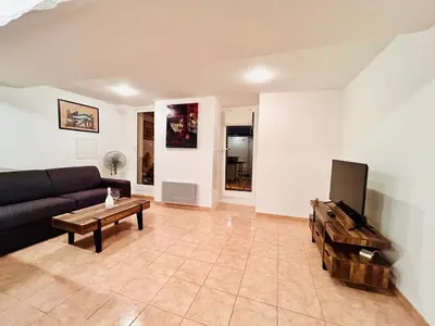 a living room with a couch and a coffee table at Riviera Mornings - Old Town Stay - 5 Min to Beach & Breakfast in Villefranche-sur-Mer