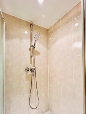 a shower with a shower head in a bathroom at Riviera Mornings - Old Town Stay - 5 Min to Beach & Breakfast in Villefranche-sur-Mer