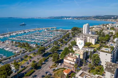 an aerial view of a harbor with a marina at Castel du Port - Happy Rentals in Saint-Laurent-du-Var