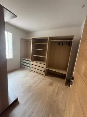 an empty room with a large closet with wooden floors at Appartement Duplex Bord de Mer in Cagnes-sur-Mer
